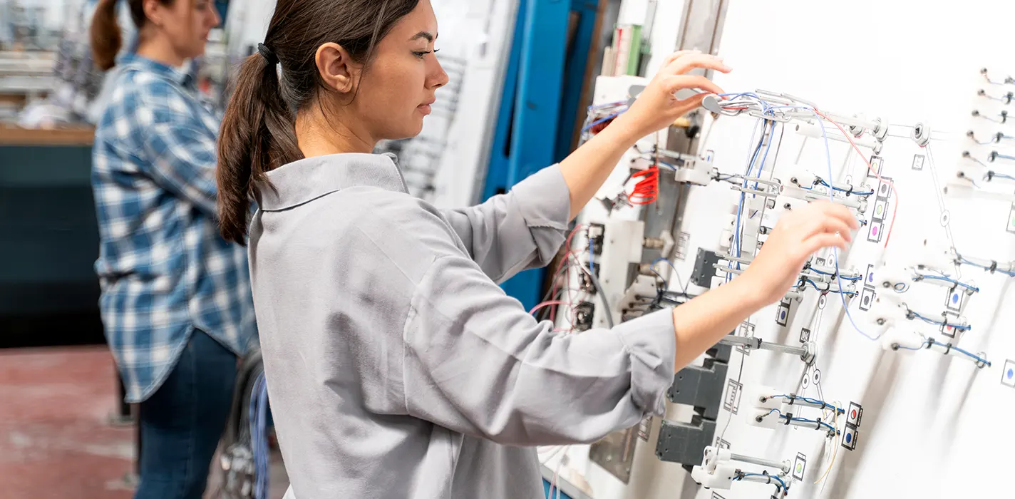 Engineer inspecting DIN rail mounting in custom metal enclosure